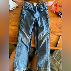 Two pairs of boys jeans used lots of life left in them